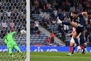 Croatia's goalkeeper Dominik Livakovic (L) dives for the save ahead of Scotland's forward Che Adams (R) during the UEFA EURO 2020 Group D football match between Croatia and Scotland at Hampden Park in Glasgow on June 22, 2021. (Getty Images)