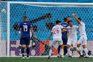 Spain's players celebrate scoring their team's first goal, an own goal scored by Slovakia's goalkeeper Martin Dubravka during the UEFA EURO 2020 Group E football match between Slovakia and Spain at La Cartuja Stadium in Seville on June 23, 2021. (Getty Images)