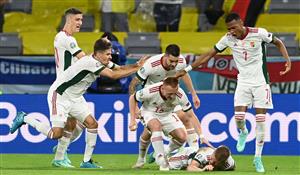 Hungary's midfielder Andras Schafer (hidden) celebrates scoring his team's second goal with his teammates during the UEFA EURO 2020 Group F football match between Germany and Hungary at the Allianz Arena in Munich on June 23, 2021. (Getty Images)