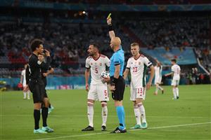 Russian referee Sergei Karasev shows a yellow card to Germany's midfielder Leroy Sane for a foul on Hungary's defender Attila Fiola at the edge of the box during the UEFA EURO 2020 Group F football match between Germany and Hungary at the Allianz Arena in Munich on June 23, 2021. (Getty Images)