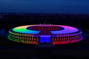 An overview picture shows the Olympic stadium illuminated with the Rainbow colours, in Berlin, eastern Germany, on June 23, 2021. (Getty Images)