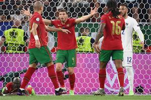 Potugal's players react as Portugal's midfielder Danilo Pereira lies on the pitch after a collision with France's goalkeeper Hugo Lloris during the UEFA EURO 2020 Group F football match between Portugal and France at Puskas Arena in Budapest on June 23, 2021. (Getty Images)
