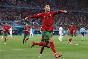 TOPSHOT - Portugal's forward Cristiano Ronaldo celebrates after scoring a second penalty kick during the UEFA EURO 2020 Group F football match between Portugal and France at Puskas Arena in Budapest on June 23, 2021. (Getty Images)