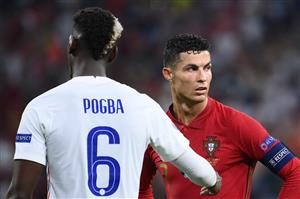 France's midfielder Paul Pogba interacts with Portugal's forward Cristiano Ronaldo during the UEFA EURO 2020 Group F football match between Portugal and France at Puskas Arena in Budapest on June 23, 2021. (Getty Images)