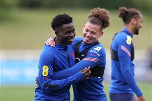 BURTON UPON TRENT, ENGLAND - JUNE 24: Bukayo Saka and Kalvin Phillips of England share a joke during a training session at St George's Park on June 24, 2021 in Burton upon Trent, England. (Getty Images)