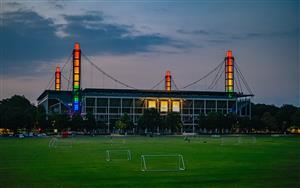 An overview picture shows the Rheinenergie Stadium illuminated with the Rainbow colours in Cologne, western Germany, on June 23, 2021. (Getty Images)