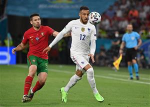 BUDAPEST, HUNGARY - JUNE 23: Corentin Tolisso of France is challenged by Raphael Guerreiro of Portugal during the UEFA Euro 2020 Championship Group F match between Portugal and France at Puskas Arena on June 23, 2021 in Budapest, Hungary. (Getty Images)