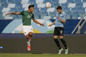CUIABA, BRAZIL - JUNE 24: Matias Viña of Uruguay heads the ball against Jeyson Chura of Bolivia during a Group A match between Bolivia and Uruguay as part of Copa America Brazil 2021 at Arena Pantanal on June 24, 2021 in Cuiaba, Brazil. (Getty Images)