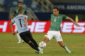 CUIABA, BRAZIL - JUNE 24: Leonel Justiniano of Bolivia fights for the ball with Nicolas De La Cruz of Uruguay during a Group A match between Bolivia and Uruguay as part of Copa America Brazil 2021 at Arena Pantanal on June 24, 2021 in Cuiaba, Brazil. (Getty Images)