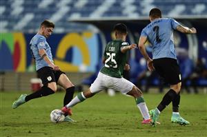 CUIABA, BRAZIL - JUNE 24: Federico Valverde of Uruguay kicks the ball again Jeyson Chura of Bolivia during a Group A match between Bolivia and Uruguay as part of Copa America Brazil 2021 at Arena Pantanal on June 24, 2021 in Cuiaba, Brazil. (Getty Images)