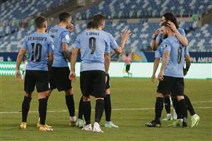 CUIABA, BRAZIL - JUNE 24: Luis Suarez of Uruguay (C) and teammates Edinson Cavani with Nahitan Nandez (R) and Giorgian De Arrascaeta (L) celebrate the first goal of their team scored by an own goal from Carlos Lampe of Bolivia (not in frame) during a Group A match between Bolivia and Uruguay as part of Copa America Brazil 2021 at Arena Pantanal on June 24, 2021 in Cuiaba, Brazil. (Getty Images)