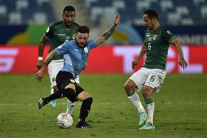 CUIABA, BRAZIL - JUNE 24: Nahitan Nandez of Uruguay kicks the ball against Leonel Justiniano of Bolivia during a Group A match between Bolivia and Uruguay as part of Copa America Brazil 2021 at Arena Pantanal on June 24, 2021 in Cuiaba, Brazil. (Getty Images)
