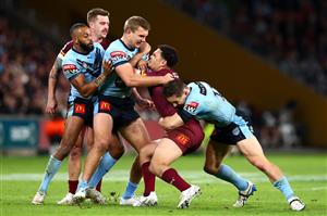 BRISBANE, AUSTRALIA - JUNE 27: Xavier Coates of the Maroons is tackled during game two of the 2021 State of Origin series between the Queensland Maroons and the New South Wales Blues at Suncorp Stadium on June 27, 2021 in Brisbane, Australia. (Photo by Chris Hyde/Getty Images)