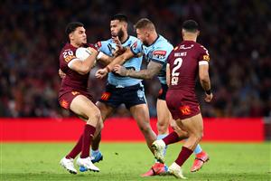 BRISBANE, AUSTRALIA - JUNE 27: Xavier Coates of the Maroons is tackled during game two of the 2021 State of Origin series between the Queensland Maroons and the New South Wales Blues at Suncorp Stadium on June 27, 2021 in Brisbane, Australia. (Photo by Chris Hyde/Getty Images)