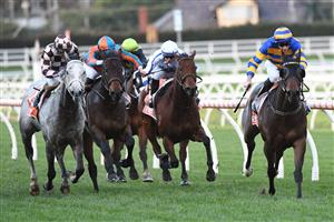 MELBOURNE, AUSTRALIA - JUNE 26: Declan Bates riding Corner Pocket winning race 8, the Neds Handicap, during Melbourne Racing at Caulfield Racecourse on June 26, 2021 in Melbourne, Australia. (Photo by Vince Caligiuri/Getty Images)