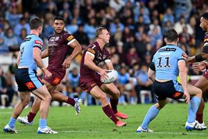 BRISBANE, AUSTRALIA - JUNE 27: Daly Cherry-Evans of the Maroons offloads the ball during game two of the 2021 State of Origin series between the Queensland Maroons and the New South Wales Blues at Suncorp Stadium on June 27, 2021 in Brisbane, Australia. (Photo by Bradley Kanaris/Getty Images)