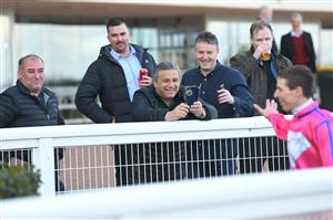MELBOURNE, AUSTRALIA - JUNE 26: Damian Lane is congratulated by happy connections after riding Divine Diosa to win race 5, the Take It To The Neds Level Handicap, during Melbourne Racing at Caulfield Racecourse on June 26, 2021 in Melbourne, Australia. (Photo by Vince Caligiuri/Getty Images)