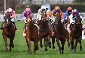 MELBOURNE, AUSTRALIA - JUNE 26: Damian Lane riding Absolute Flirt winning race 6, the Neds Bet Back Handicap, during Melbourne Racing at Caulfield Racecourse on June 26, 2021 in Melbourne, Australia. (Photo by Vince Caligiuri/Getty Images)