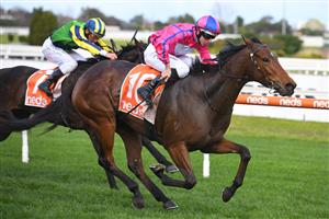 MELBOURNE, AUSTRALIA - JUNE 26: Damian Lane riding Divine Diosa winning race 5, the Take It To The Neds Level Handicap, during Melbourne Racing at Caulfield Racecourse on June 26, 2021 in Melbourne, Australia. (Photo by Vince Caligiuri/Getty Images)