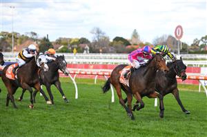 MELBOURNE, AUSTRALIA - JUNE 26: Damian Lane riding Divine Diosa winning race 5, the Take It To The Neds Level Handicap, during Melbourne Racing at Caulfield Racecourse on June 26, 2021 in Melbourne, Australia. (Photo by Vince Caligiuri/Getty Images)