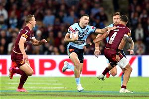 BRISBANE, AUSTRALIA - JUNE 27: James Tedesco of the Blues makes a break during game two of the 2021 State of Origin series between the Queensland Maroons and the New South Wales Blues at Suncorp Stadium on June 27, 2021 in Brisbane, Australia. (Photo by Chris Hyde/Getty Images)