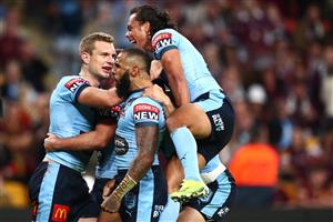 BRISBANE, AUSTRALIA - JUNE 27: Tom Trbojevic of the Blues celebrates after scoring a try with James Tedesco, Josh Addo-Carr and Jarome Luai of the Blues during game two of the 2021 State of Origin series between the Queensland Maroons and the New South Wales Blues at Suncorp Stadium on June 27, 2021 in Brisbane, Australia. (Photo by Chris Hyde/Getty Images)