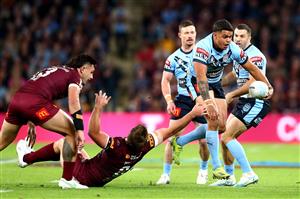 BRISBANE, AUSTRALIA - JUNE 27: Latrell Mitchell of the Blues makes a break during game two of the 2021 State of Origin series between the Queensland Maroons and the New South Wales Blues at Suncorp Stadium on June 27, 2021 in Brisbane, Australia. (Photo by Chris Hyde/Getty Images)