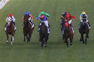 SYDNEY, AUSTRALIA - JUNE 26: Regan Bayliss on Mirra Vision (red cap with white stars) wins race 8 the ACY Securities Handicap during Sydney Racing at Rosehill Gardens on June 26, 2021 in Sydney, Australia. (Photo by Mark Evans/Getty Images)