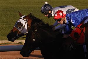 SYDNEY, AUSTRALIA - JUNE 26: Regan Bayliss on Mirra Vision (red cap with white stars) wins race 8 the ACY Securities Handicap during Sydney Racing at Rosehill Gardens on June 26, 2021 in Sydney, Australia. (Photo by Mark Evans/Getty Images)