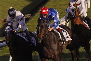 SYDNEY, AUSTRALIA - JUNE 26: Regan Bayliss on Mirra Vision (red cap with white stars) wins race 8 the ACY Securities Handicap during Sydney Racing at Rosehill Gardens on June 26, 2021 in Sydney, Australia. (Photo by Mark Evans/Getty Images)