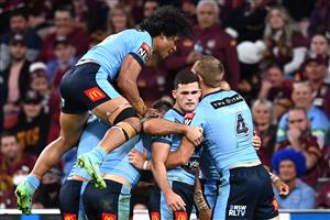 BRISBANE, AUSTRALIA - JUNE 27: Tom Trbojevic of the Blues celebrates with team mates after scoring a try during game two of the 2021 State of Origin series between the Queensland Maroons and the New South Wales Blues at Suncorp Stadium on June 27, 2021 in Brisbane, Australia. (Photo by Bradley Kanaris/Getty Images)