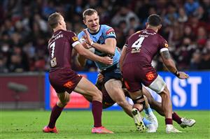BRISBANE, AUSTRALIA - JUNE 27: Tom Trbojevic of the Blues is tackled during game two of the 2021 State of Origin series between the Queensland Maroons and the New South Wales Blues at Suncorp Stadium on June 27, 2021 in Brisbane, Australia. (Photo by Bradley Kanaris/Getty Images)