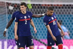 France's forward Kylian Mbappe (R) is consoled by teammates after missing the penalty during the UEFA EURO 2020 round of 16 football match between France and Switzerland at the National Arena in Bucharest on June 28, 2021. (Getty Images)