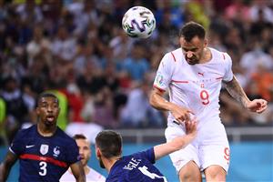 Switzerland's forward Haris Seferovic (R) heads the ball to score the first goal during the UEFA EURO 2020 round of 16 football match between France and Switzerland at the National Arena in Bucharest on June 28, 2021. (Getty Images)