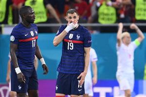 France's midfielder Moussa Sissoko (L) and France's forward Karim Benzema react after conceding a third goal during the UEFA EURO 2020 round of 16 football match between France and Switzerland at the National Arena in Bucharest on June 28, 2021. (Getty Images)