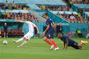 Switzerland's forward Mario Gavranovic (L) shoots to score their third goal during the UEFA EURO 2020 round of 16 football match between France and Switzerland at the National Arena in Bucharest on June 28, 2021. (Getty Images)