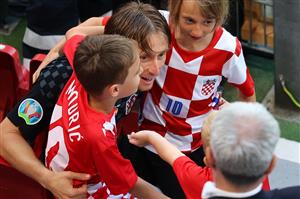Croatia's midfielder Luka Modric speaks with children at the end of the UEFA EURO 2020 round of 16 football match between Croatia and Spain at the Parken Stadium in Copenhagen on June 28, 2021. (Getty Images)