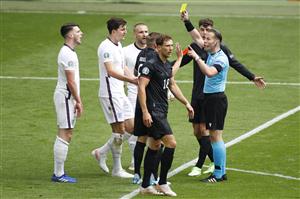 Dutch referee Danny Makkelie (R) presents a yellow card to England's midfielder Declan Rice (L) after a foul on Germany's midfielder Leon Goretzka (C) during the UEFA EURO 2020 round of 16 football match between England and Germany at Wembley Stadium in London on June 29, 2021. (Getty Images)