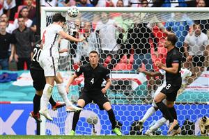 England's defender Harry Maguire (L) heads the ball towards goal during the UEFA EURO 2020 round of 16 football match between England and Germany at Wembley Stadium in London on June 29, 2021. (Getty Images)