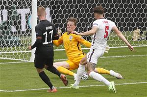 England's goalkeeper Jordan Pickford (C) saves a shot by Germany's forward Timo Werner (L) during the UEFA EURO 2020 round of 16 football match between England and Germany at Wembley Stadium in London on June 29, 2021. (Getty Images)