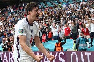 England's defender Harry Maguire celebrates with the fans after his team scored the second goal during the UEFA EURO 2020 round of 16 football match between England and Germany at Wembley Stadium in London on June 29, 2021. (Getty Images)