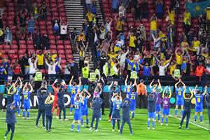 TOPSHOT - Ukraine's players celebrates with supporters after winning the UEFA EURO 2020 round of 16 football match between Sweden and Ukraine at Hampden Park in Glasgow on June 29, 2021. (Getty Images)