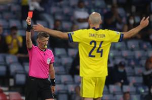 TOPSHOT - Italian referee Daniele Orsato (L) shows a red card to Sweden's defender Marcus Danielsson (R) during the UEFA EURO 2020 round of 16 football match between Sweden and Ukraine at Hampden Park in Glasgow on June 29, 2021. (Getty Images)
