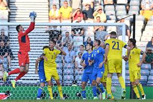 Ukraine's goalkeeper Georgiy Bushchan (L) catches the ball during the UEFA EURO 2020 round of 16 football match between Sweden and Ukraine at Hampden Park in Glasgow on June 29, 2021. (Getty Images)