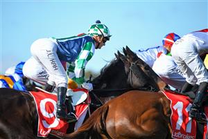 MELBOURNE, AUSTRALIA - JUNE 30: Jamie Kah riding Bellx (unplaced) in Race 4, the Ladbrokes Easy Form Handicap, during Melbourne Racing at Sandown Lakeside on June 30, 2021 in Melbourne, Australia. (Photo by Vince Caligiuri/Getty Images)