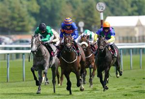 NEWTON-LE-WILLOWS, ENGLAND - JULY 01: Oneforthegutter and Dougie Costello (centre, blue/orange) coming home to win the EBF Stallions Maiden Stakes at Haydock Park Racecourse on July 1, 2021 in Newton-le-Willows, England. (Photo by Martin Rickett - Pool/Getty Images)