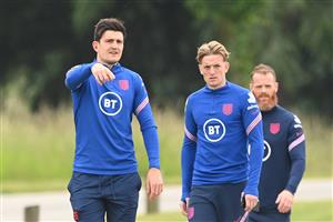 BURTON UPON TRENT, ENGLAND - JUNE 30: Harry Maguire and Jordan Pickford of England speak during a recovery walk at St George's Park on June 30, 2021 in Burton upon Trent, England. (Getty Images)