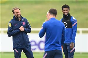 BURTON UPON TRENT, ENGLAND - JUNE 30: Gareth Southgate, Head Coach of England, and Marcus Rashford of England react during an England training session at St George's Park on June 30, 2021 in Burton upon Trent, England. (Getty Images)