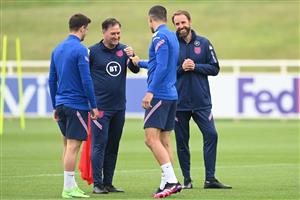 BURTON UPON TRENT, ENGLAND - JUNE 30: Gareth Southgate, Head Coach of England reacts as Steve Holland, Assistant Head Coach of England, and Conor Coady of England interact during an England training session at St George's Park on June 30, 2021 in Burton upon Trent, England. (Getty Images)