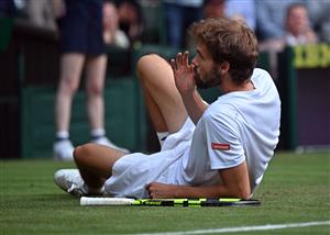 Germany's Oscar Otte gestures after falling in his match against returns against Britain's Andy Murray during their men's singles second round match on the third day of the 2021 Wimbledon Championships at The All England Tennis Club in Wimbledon, southwest London, on June 30, 2021. (Getty Images)